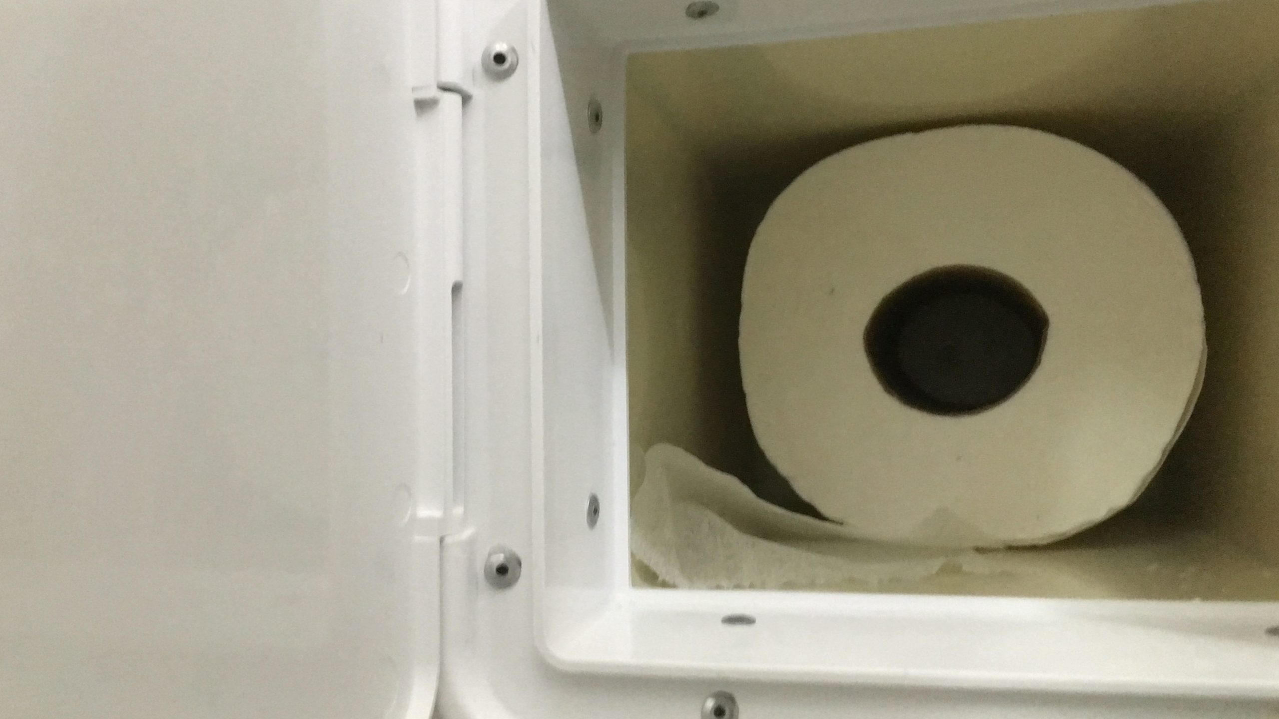 toilet paper holder in a casita trailer bathroom