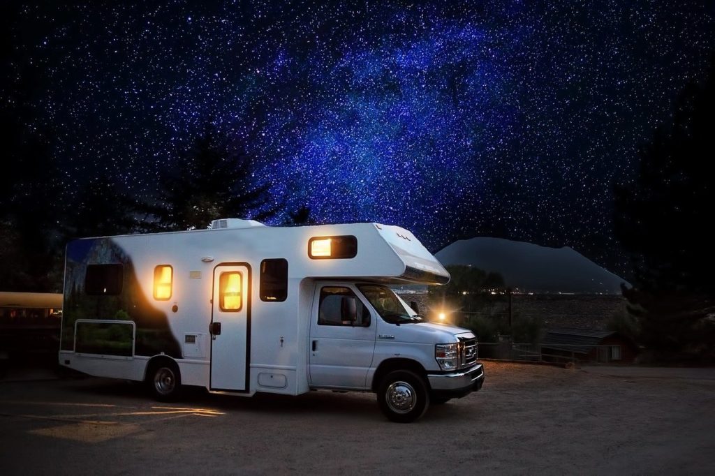 Photo of an RV with the stars in the background.