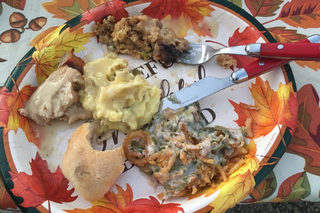 thanksgiving dinner plate on the picnic table in a campground