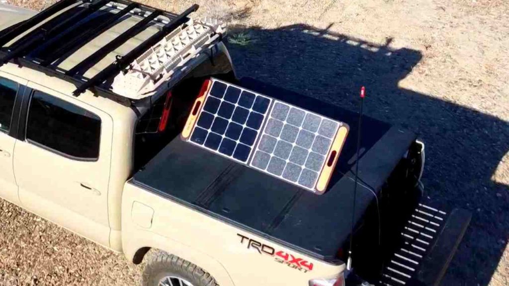Jackery solar panels on the bed of a Tacoma truck