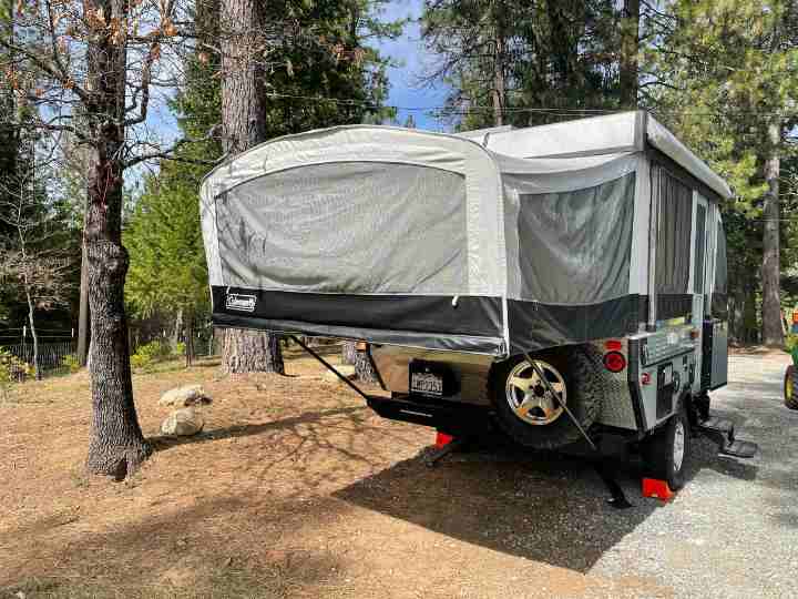 A pop up tent trailer set up