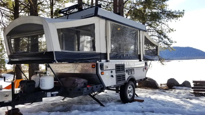 pop up camper set up in the snow