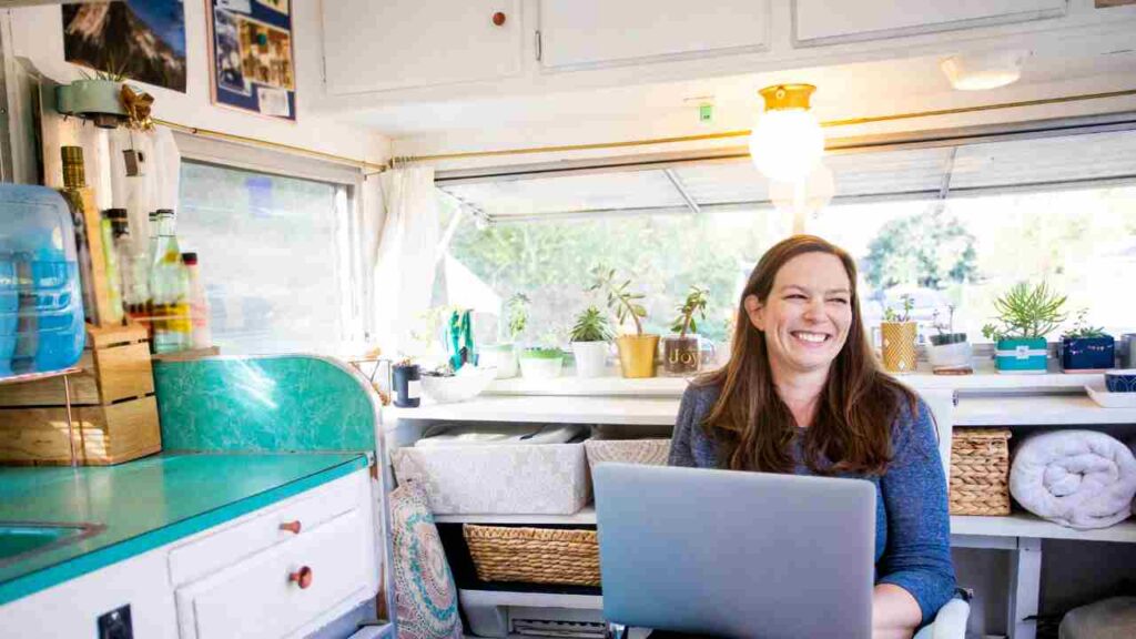 woman in an rv with a laptop