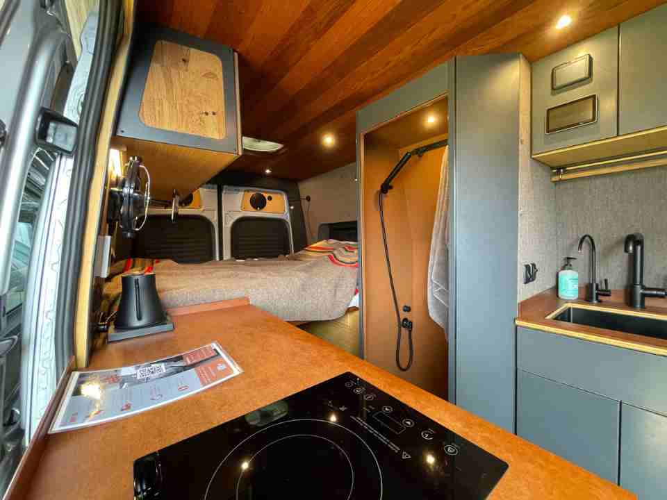 Interior of a camper van with an induction stove top