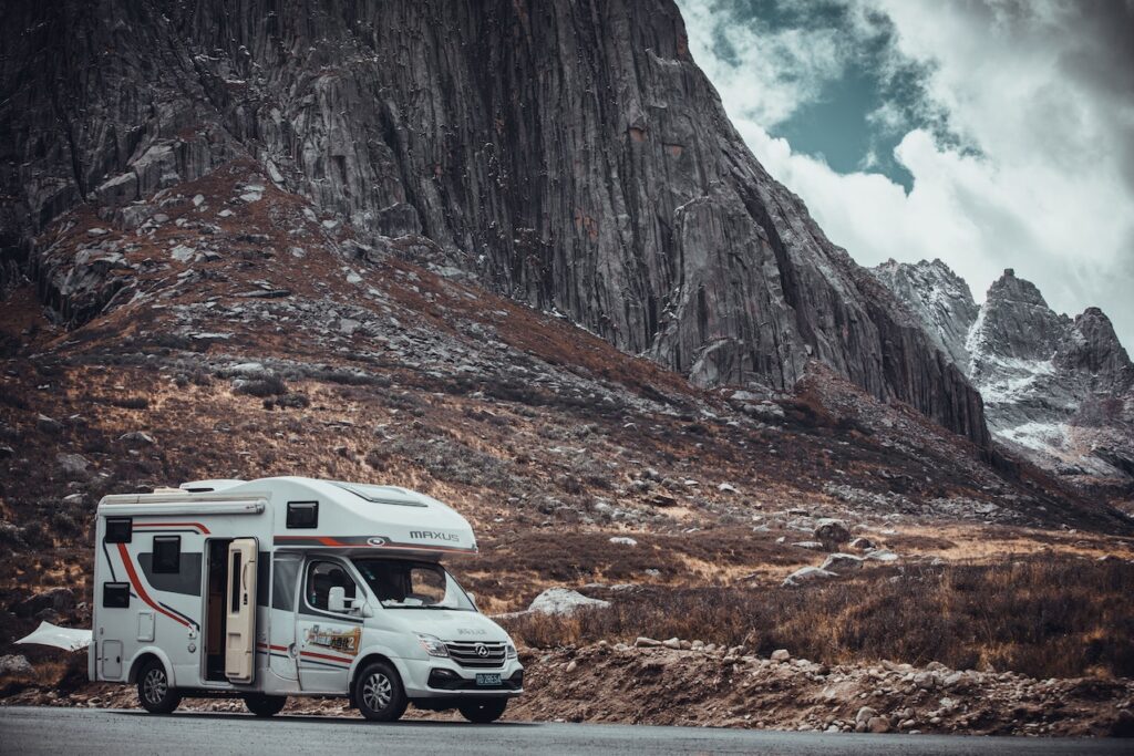 Class C RV in front of a mountain