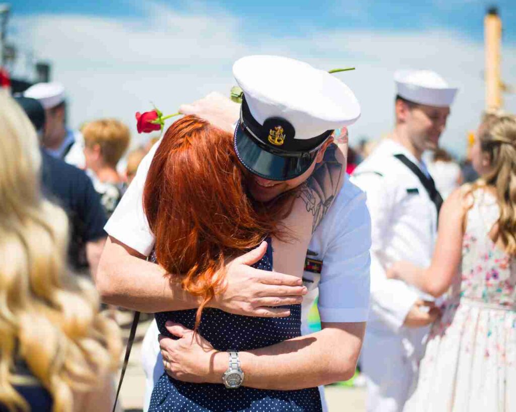 A naval officer greets his fiance