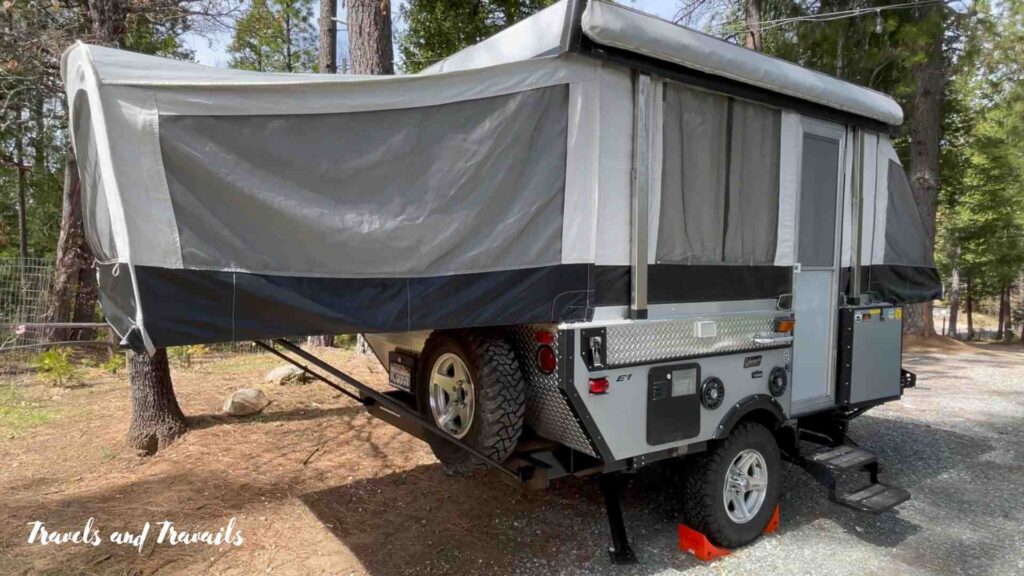 A pop-up tent camper set up