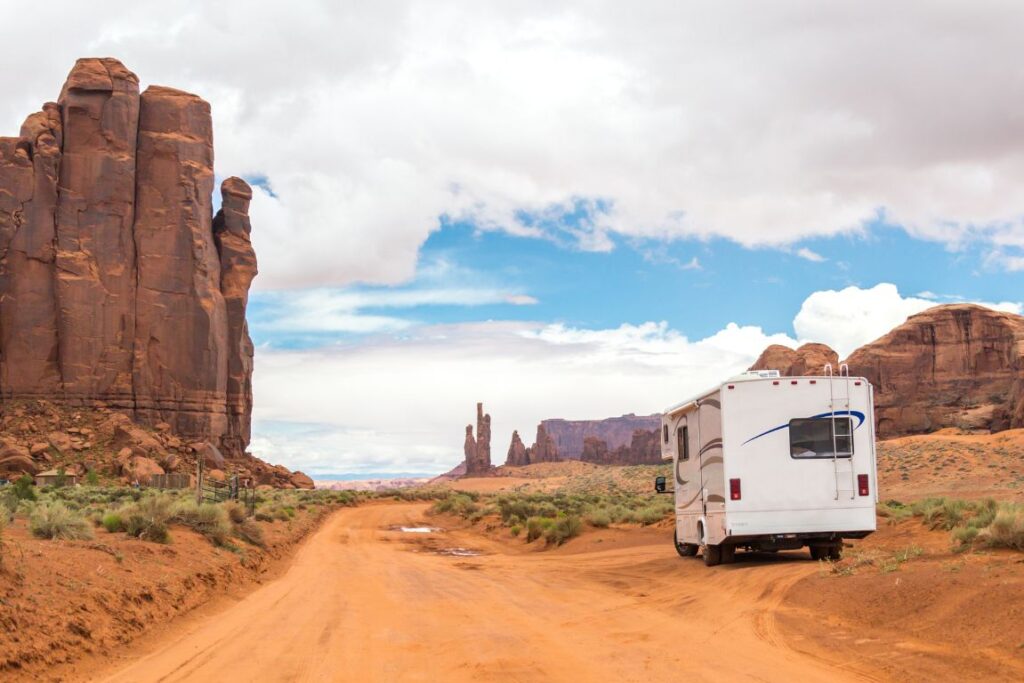 a motorhome parked on a desert road